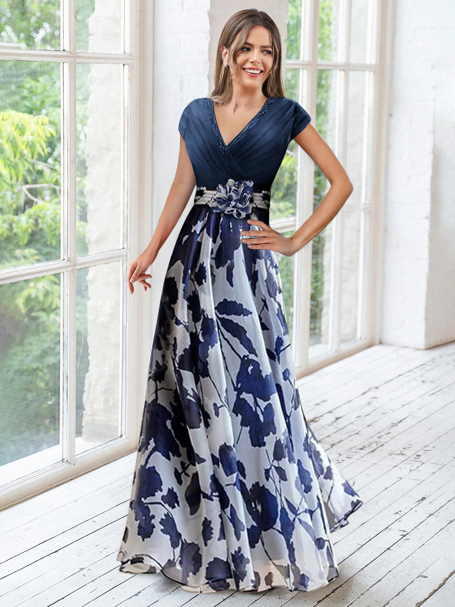 Elegant navy A-line mother of the bride dress featuring floral embellishments and a flattering V-neck design, perfect for special occasions. 0