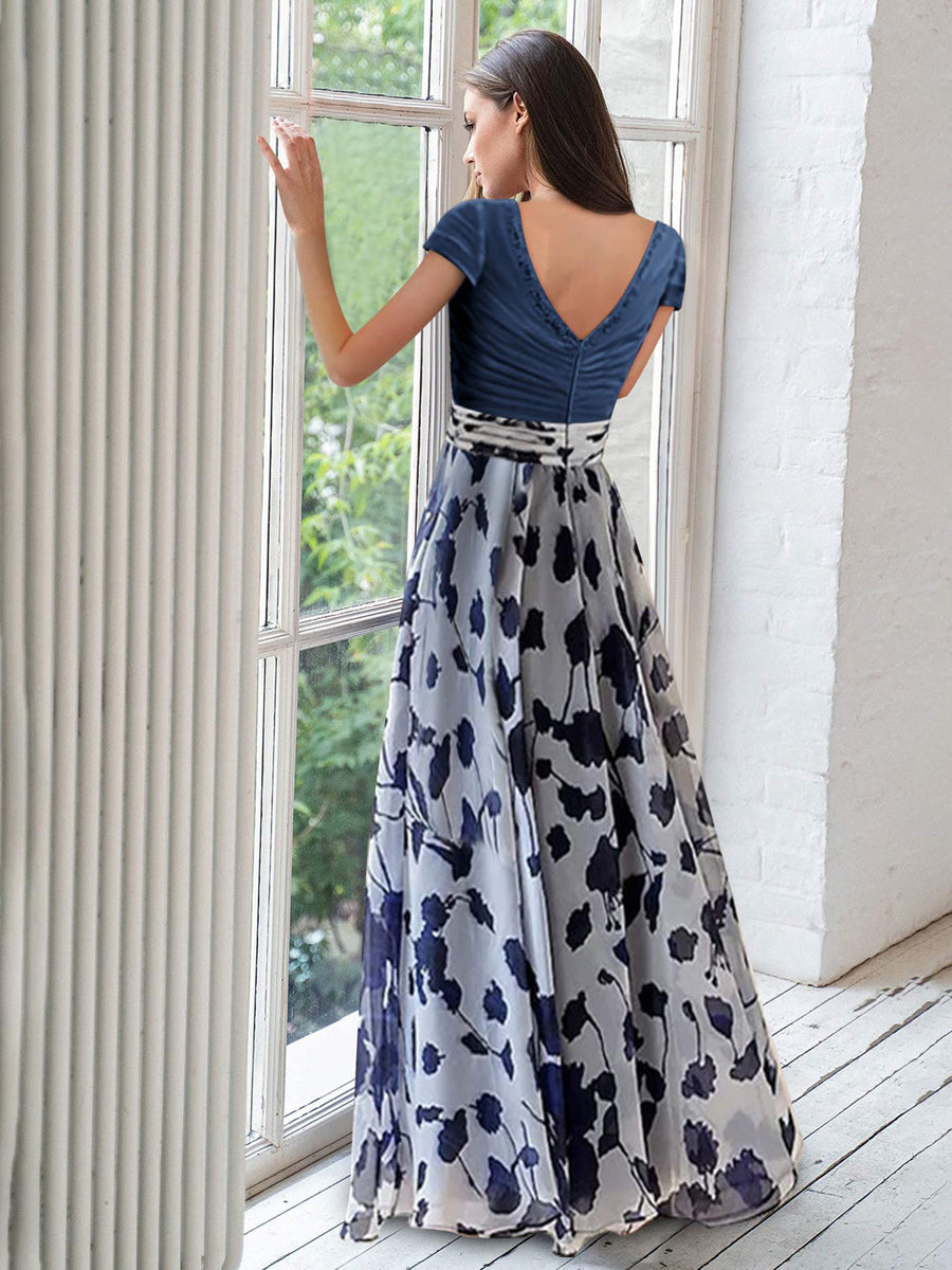 Elegant navy A-line mother of the bride dress featuring floral embellishments and a flattering V-neck design, perfect for special occasions. 1