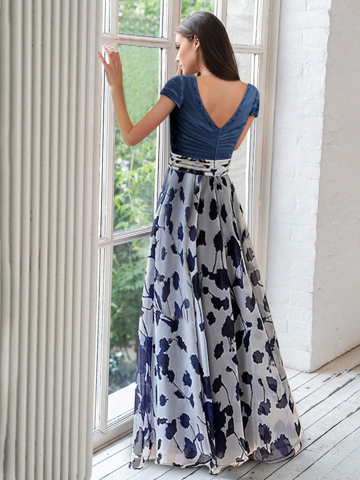 Elegant navy A-line mother of the bride dress featuring floral embellishments and a flattering V-neck design, perfect for special occasions. 1