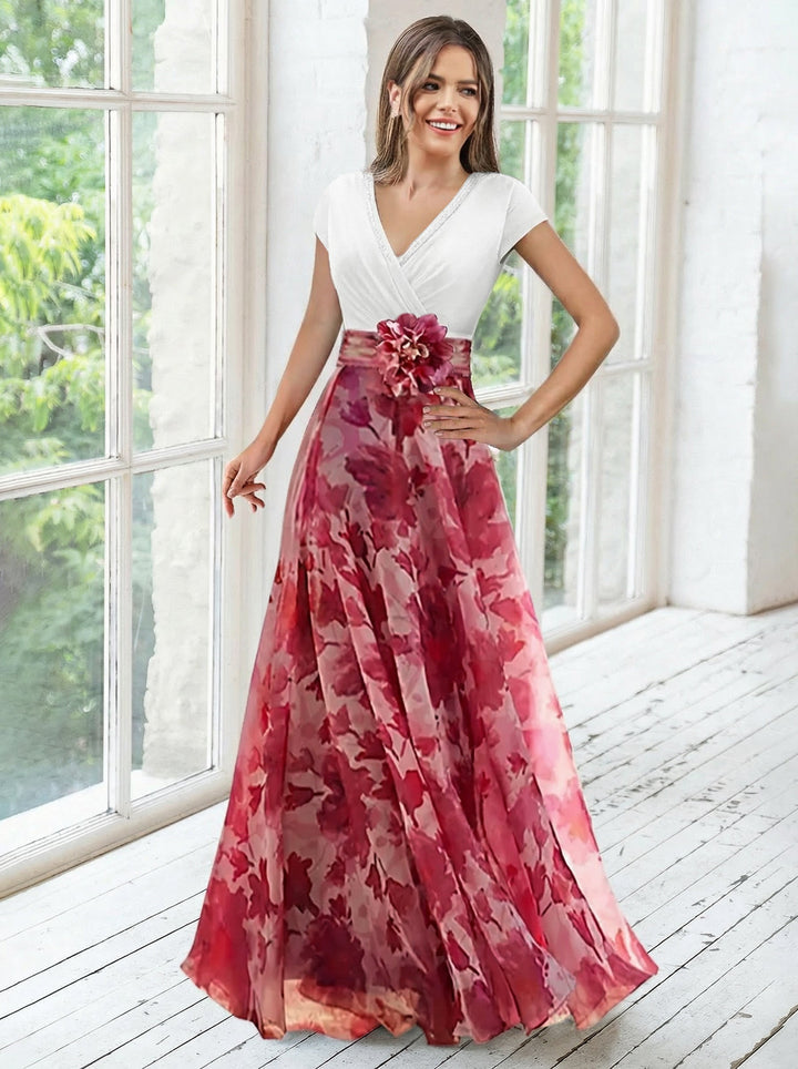 Elegant navy A-line mother of the bride dress featuring floral embellishments and a flattering V-neck design, perfect for special occasions. 10