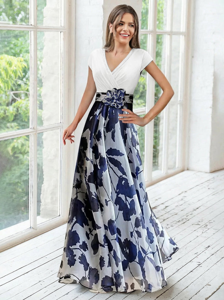 Elegant navy A-line mother of the bride dress featuring floral embellishments and a flattering V-neck design, perfect for special occasions. 3