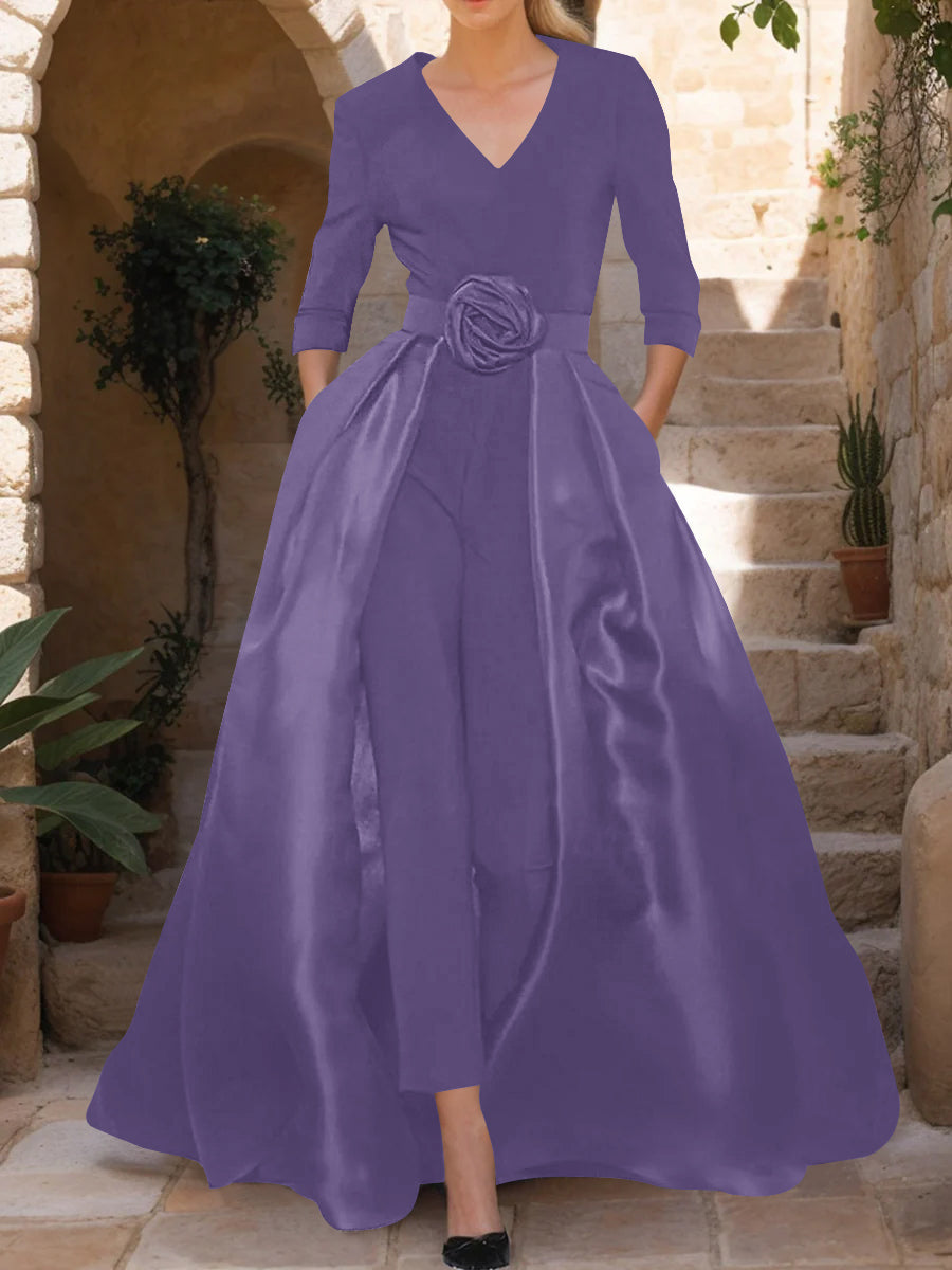 Elegant black jumpsuit for women featuring a flattering V-neck and stylish 3/4 sleeves, made from comfortable stretch fabric and designed with a beautiful flower 9