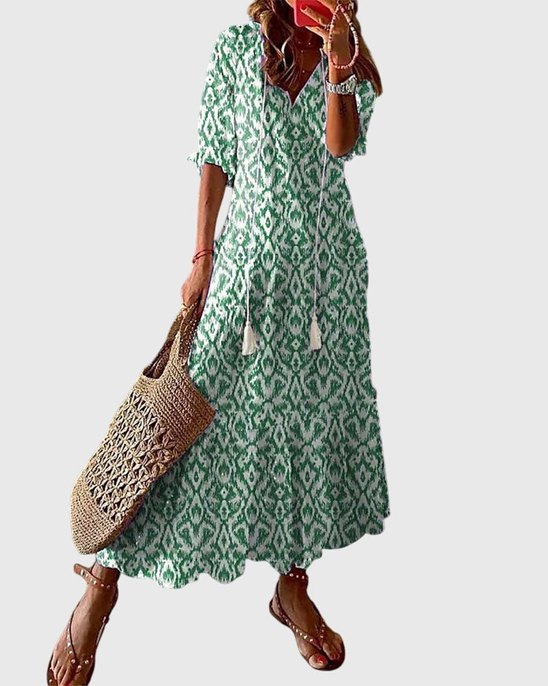 Boho vintage summer dress featuring a flattering V-neckline, lightweight fabric, and versatile design, perfect for casual outings and warm-weather events. 1