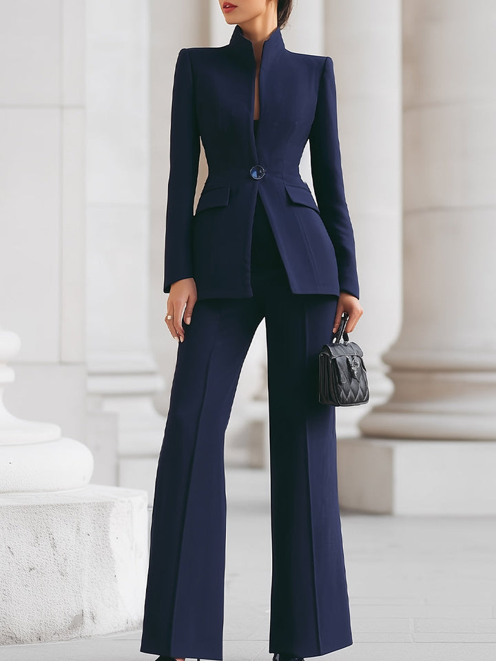 Elegant blazer and trouser suit set featuring a tailored fit and elongated silhouette, perfect for professional and formal occasions. 0