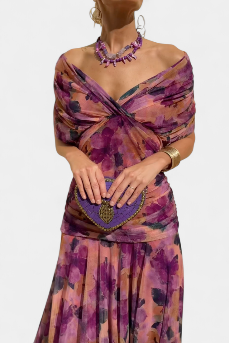 Elegant floral dress featuring a flattering V-neckline, pleated waist, and a long flowing skirt, perfect for any special occasion. 10