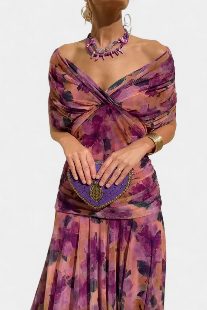 Elegant floral dress featuring a flattering V-neckline, pleated waist, and a long flowing skirt, perfect for any special occasion. 10