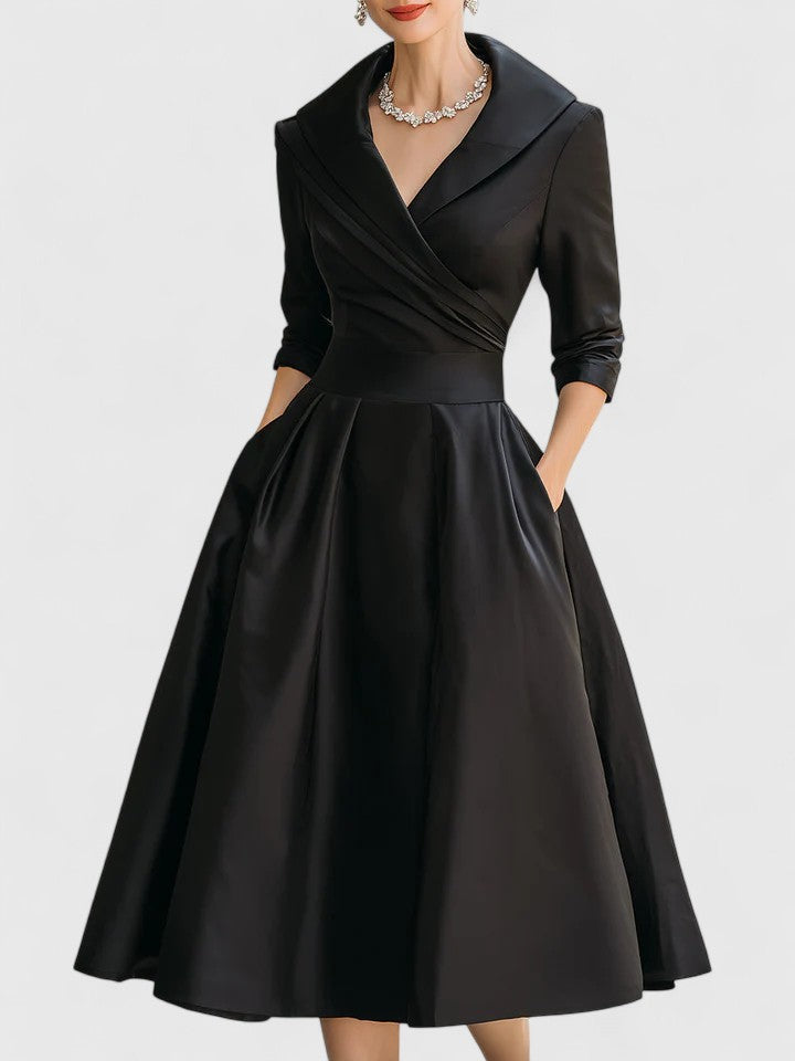 Elegant midi dress featuring discreet pockets, perfect for versatile styling and timeless fashion. 0