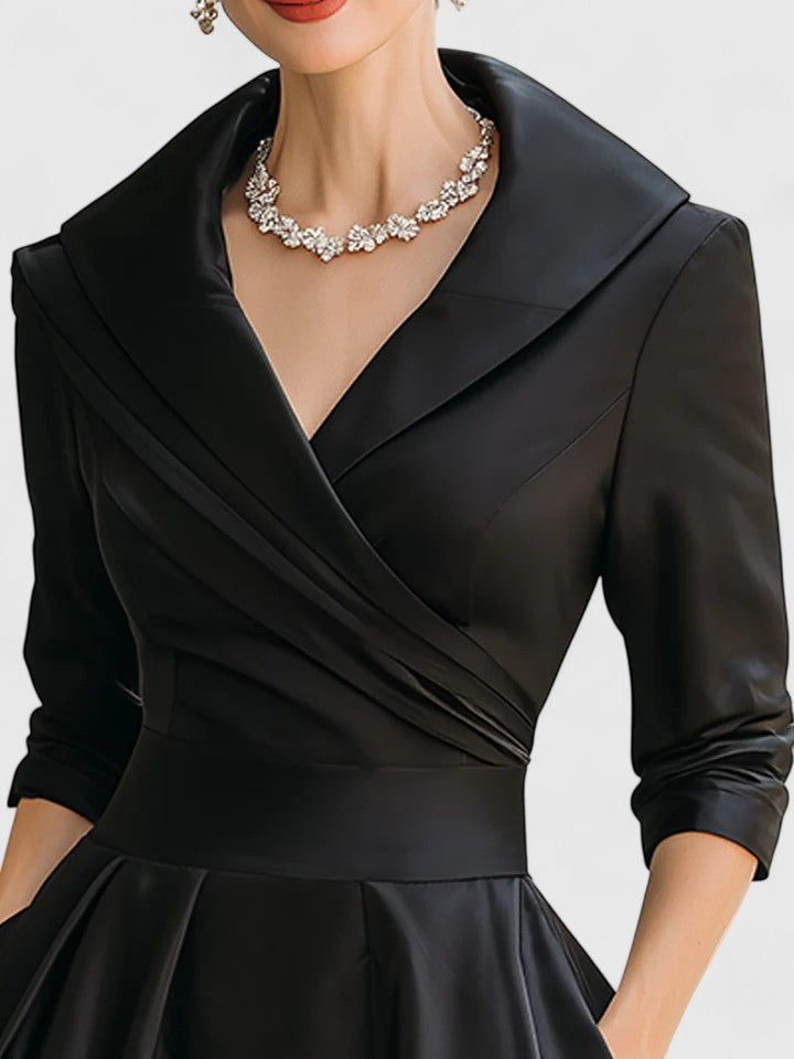 Elegant midi dress featuring discreet pockets, perfect for versatile styling and timeless fashion. 1