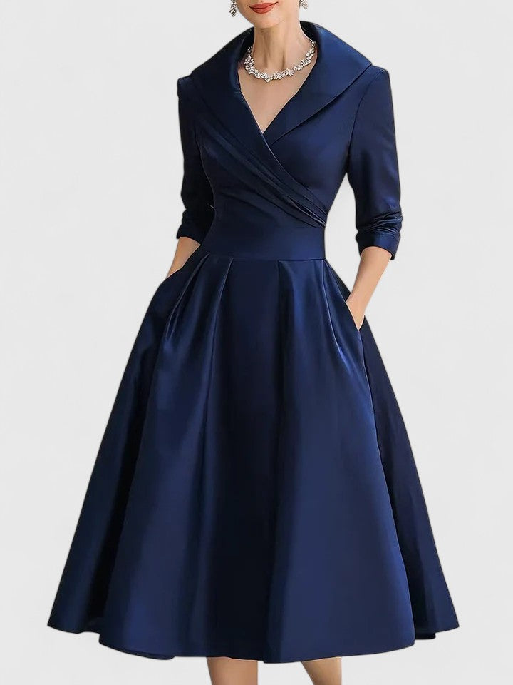 Elegant midi dress featuring discreet pockets, perfect for versatile styling and timeless fashion. 4