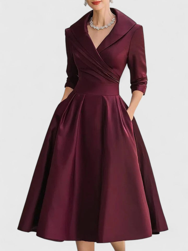 Elegant midi dress featuring discreet pockets, perfect for versatile styling and timeless fashion. 5