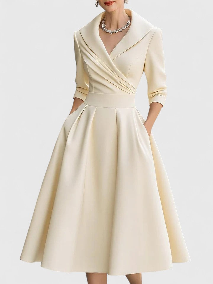 Elegant midi dress featuring discreet pockets, perfect for versatile styling and timeless fashion. 6