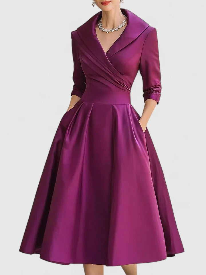Elegant midi dress featuring discreet pockets, perfect for versatile styling and timeless fashion. 7
