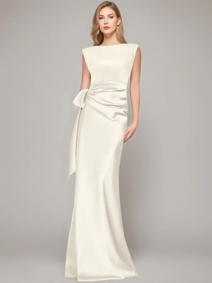 Elegant floor-length champagne satin sheath dress for the mother of the bride, featuring a stylish bow and shoulder pads for a sophisticated look. 17
