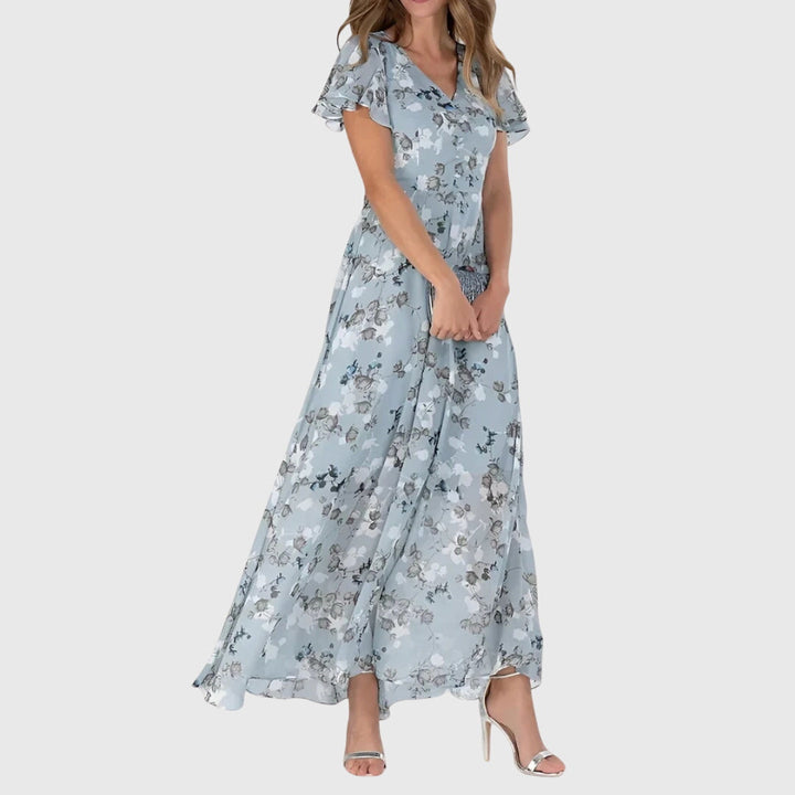 Elegant figure-flattering dress with a tailored design, perfect for versatile styling and various occasions. 1