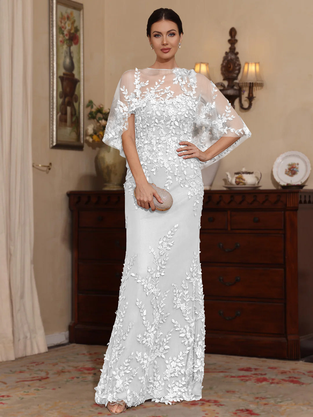 Elegant pearl pink floor-length lace mother of the bride dress featuring intricate beaded details and a flattering sheath design. 47
