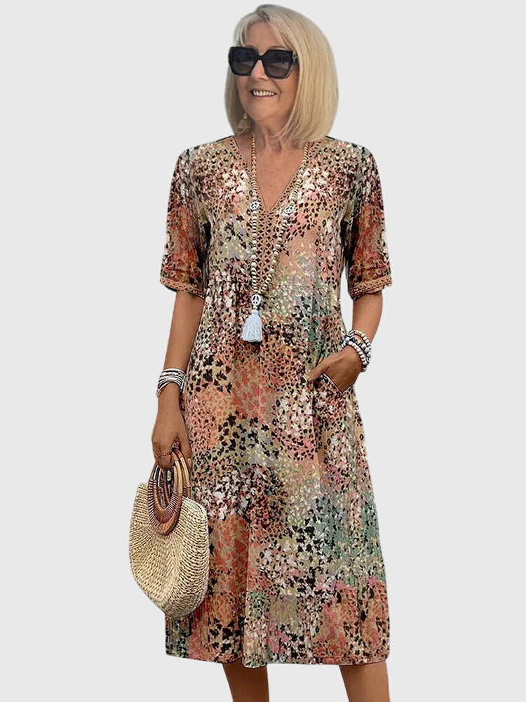 Floral midi dress featuring a chic design and breathable fabric, perfect for elegant and versatile styling in any season. 0