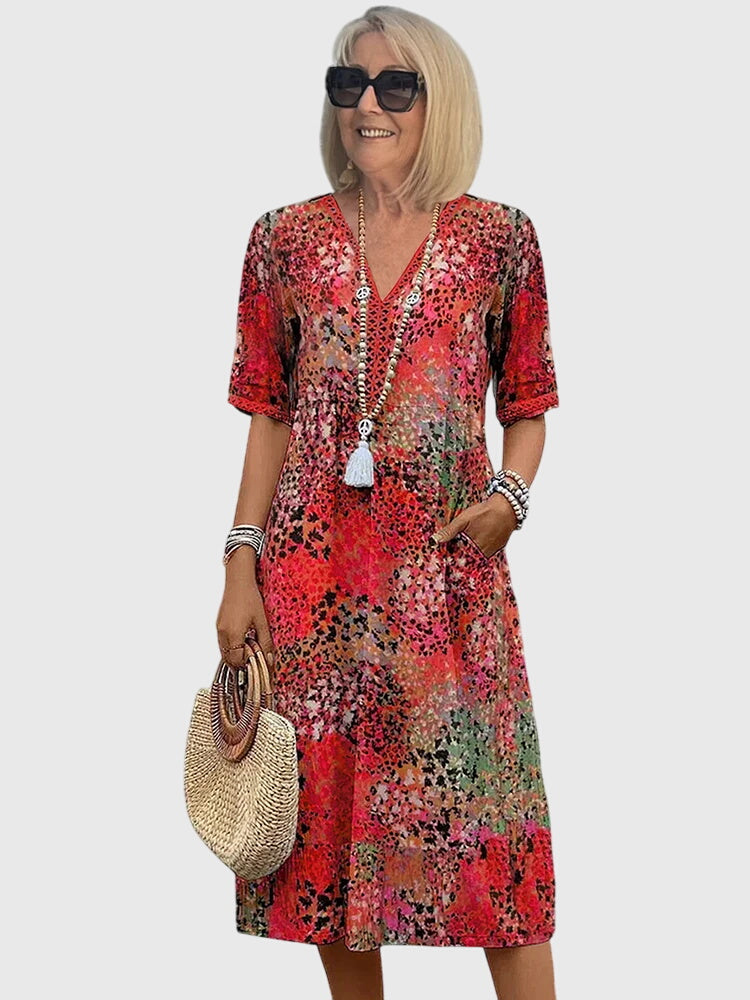 Floral midi dress featuring a chic design and breathable fabric, perfect for elegant and versatile styling in any season. 1