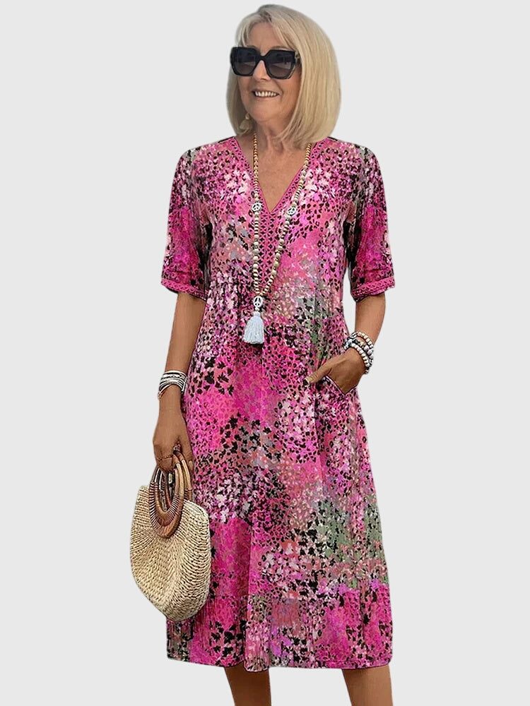 Floral midi dress featuring a chic design and breathable fabric, perfect for elegant and versatile styling in any season. 3