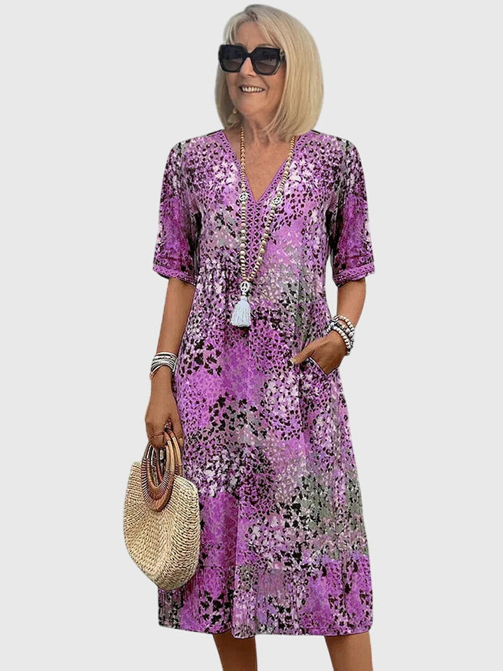 Floral midi dress featuring a chic design and breathable fabric, perfect for elegant and versatile styling in any season. 4
