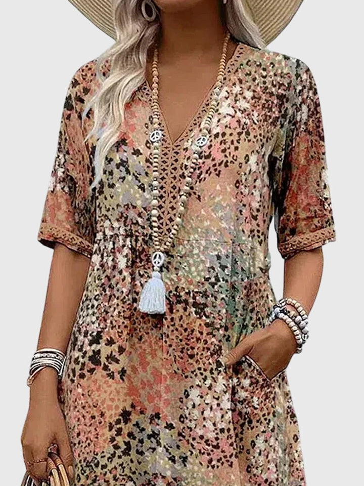 Floral midi dress featuring a chic design and breathable fabric, perfect for elegant and versatile styling in any season. 5