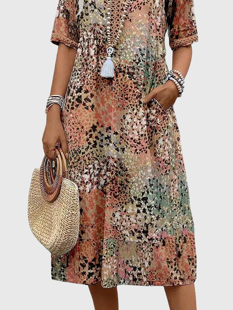 Floral midi dress featuring a chic design and breathable fabric, perfect for elegant and versatile styling in any season. 6