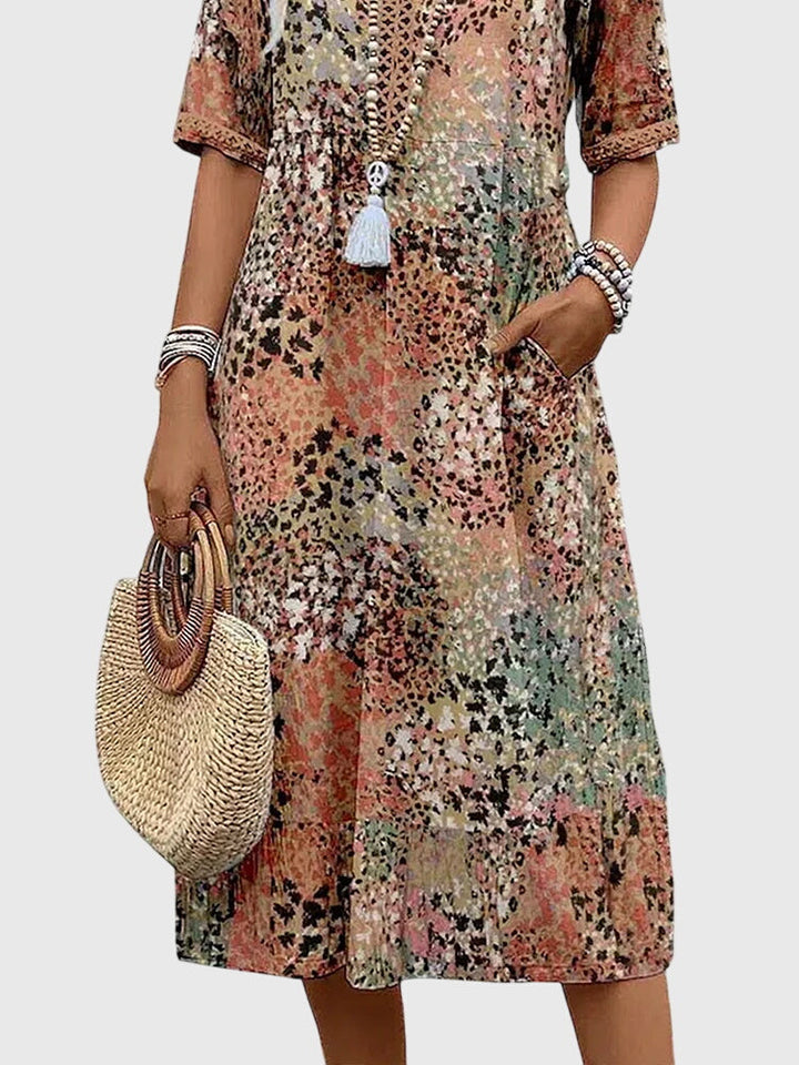 Floral midi dress featuring a chic design and breathable fabric, perfect for elegant and versatile styling in any season. 6