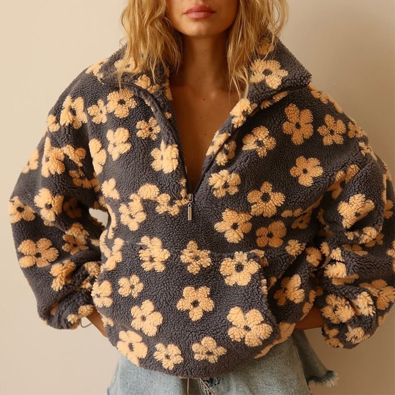 Floral teddy fleece jacket featuring an oversized retro daisy print and half zip closure, made from cozy sherpa fabric for ultimate comfort and style. 0