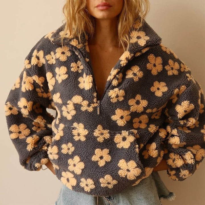 Floral teddy fleece jacket featuring an oversized retro daisy print and half zip closure, made from cozy sherpa fabric for ultimate comfort and style. 0