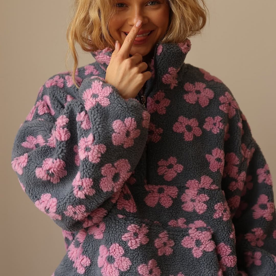 Floral teddy fleece jacket featuring an oversized retro daisy print and half zip closure, made from cozy sherpa fabric for ultimate comfort and style. 3