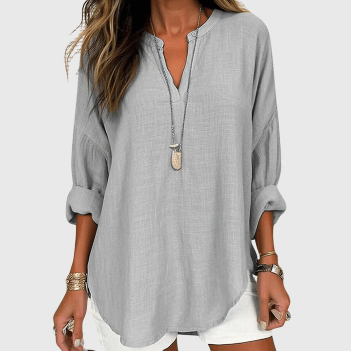 Flowy beach shirt featuring an elegant design and relaxed fit, perfect for summer outings; made from breathable fabric for ultimate comfort. 4