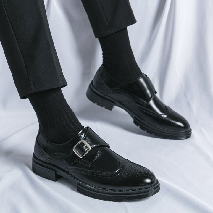Men's dress shoes featuring elegant wingtip brogue detailing and a stylish single buckle closure, crafted in a sophisticated leather look, perfect for formal occasions. 3