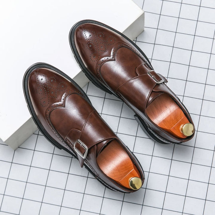 Men's dress shoes featuring elegant wingtip brogue detailing and a stylish single buckle closure, crafted in a sophisticated leather look, perfect for formal occasions. 4