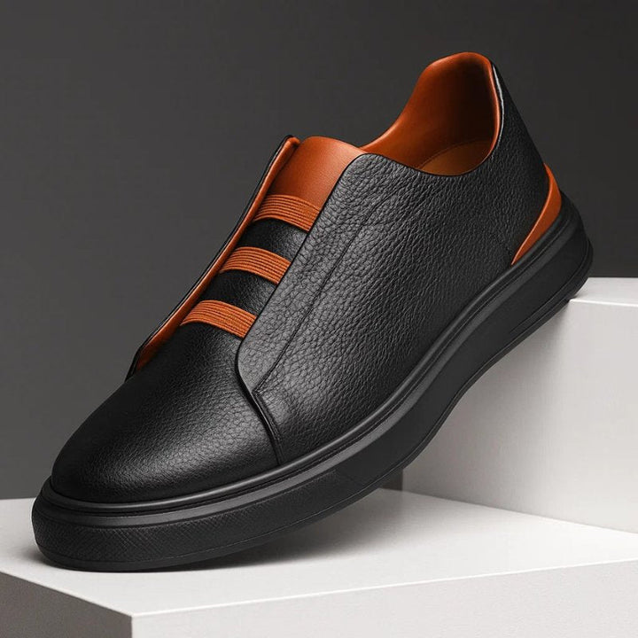 Men's genuine leather sneakers featuring an elastic strap system, designed for slip-on convenience and everyday comfort, perfect for casual wear. 2