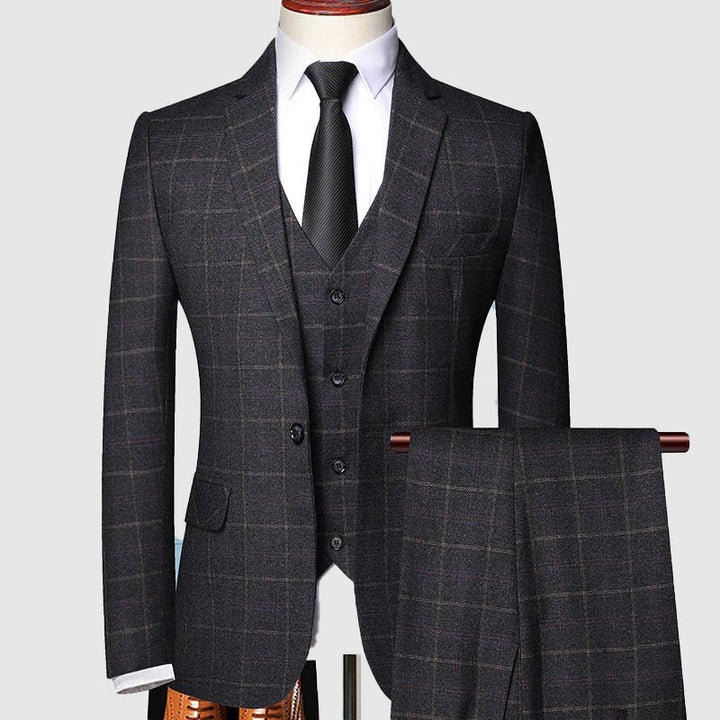 Men's three-piece suit featuring a stylish windowpane check pattern, designed for weddings and formal events, crafted from high-quality fabric for a tailored fit. 2