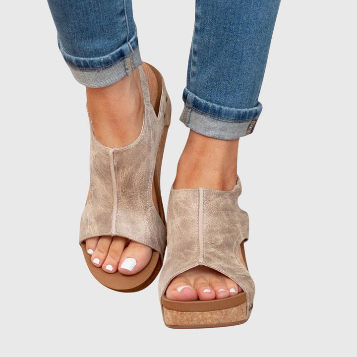 Orthopedic sandals featuring a cushioned insole, adjustable buckle, and lightweight wedge design, perfect for all-day comfort and support. 0