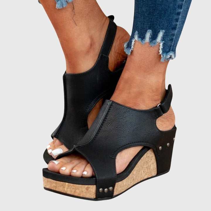 Orthopedic sandals featuring a cushioned insole, adjustable buckle, and lightweight wedge design, perfect for all-day comfort and support. 5