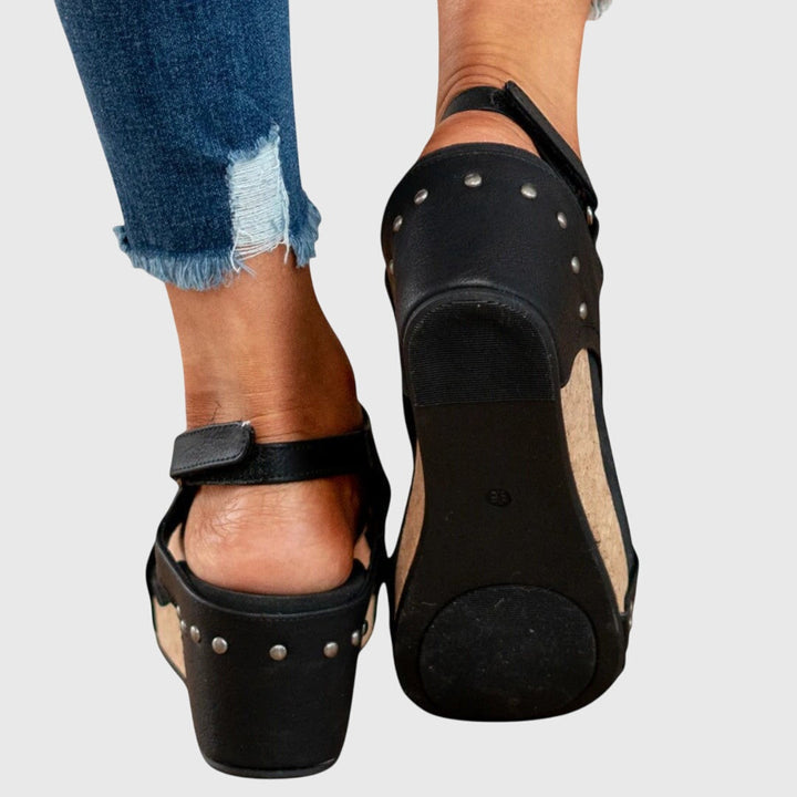 Orthopedic sandals featuring a cushioned insole, adjustable buckle, and lightweight wedge design, perfect for all-day comfort and support. 7