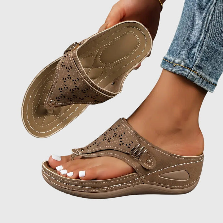 Orthopedic sandals featuring ergonomic support, a shock-absorbing sole, and a convenient slip-on design for ultimate comfort and foot health. 1