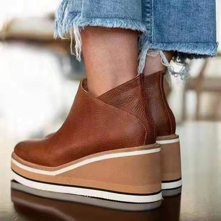 Orthopedic waterproof boots featuring an easy side zipper and a sleek design, perfect for all-weather comfort and support. 4