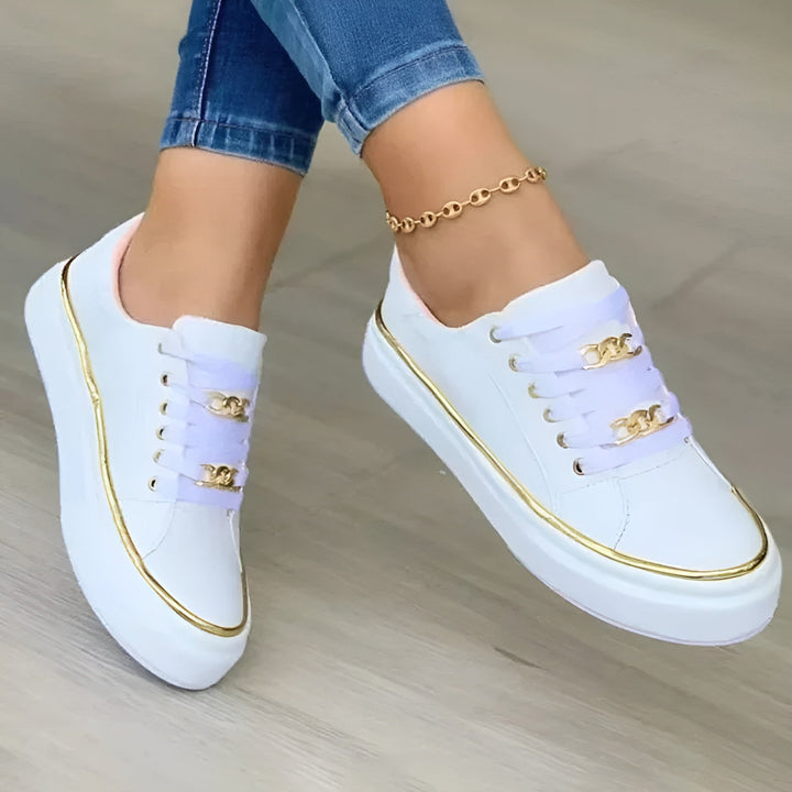 Orthopedic women's sneakers featuring shock-absorbing soles and stylish golden accents, perfect for comfort and fashion. 0