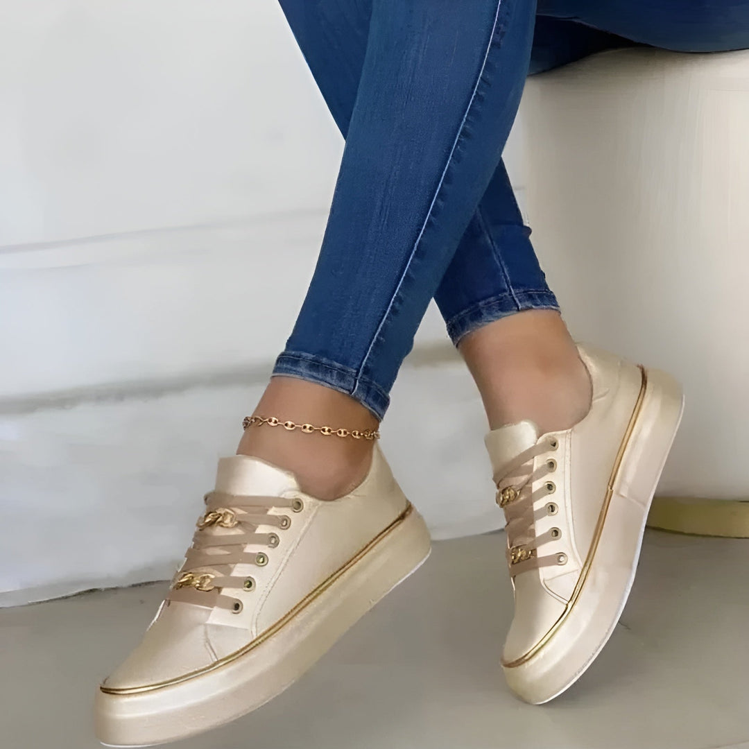 Orthopedic women's sneakers featuring shock-absorbing soles and stylish golden accents, perfect for comfort and fashion. 4