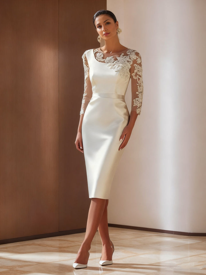 Elegant ivory sheath cocktail dress featuring intricate appliqued details, knee-length satin design, perfect for weddings and formal events. 0