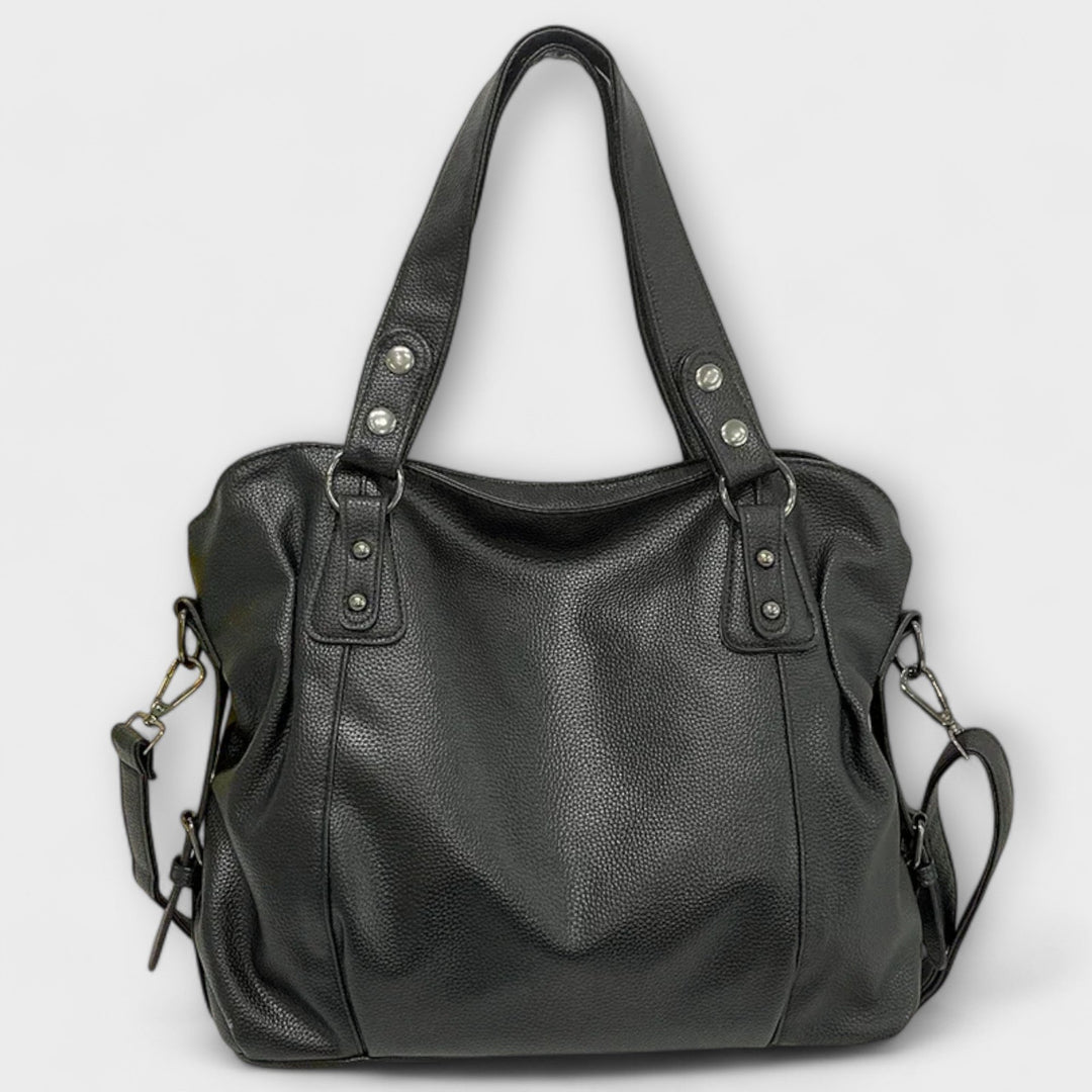 Vegan leather shoulder bag featuring an adjustable strap, multiple compartments, and a spacious design for versatile use as a large capacity tote. 6