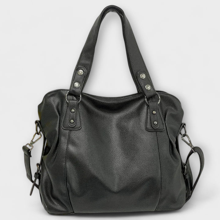 Vegan leather shoulder bag featuring an adjustable strap, multiple compartments, and a spacious design for versatile use as a large capacity tote. 6