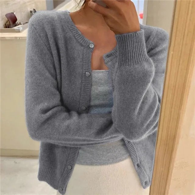 Women's cropped cardigan in black with button front, featuring a soft knit texture and relaxed fit, perfect for casual layering. 0
