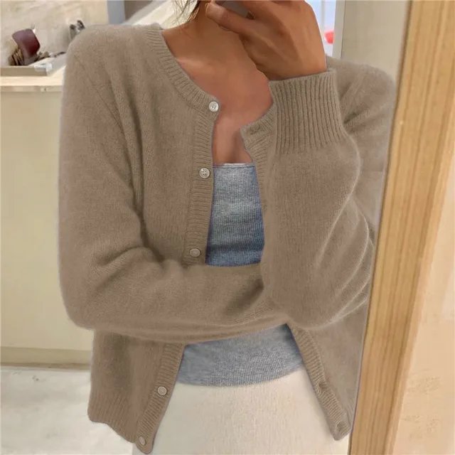 Women's cropped cardigan in black with button front, featuring a soft knit texture and relaxed fit, perfect for casual layering. 4