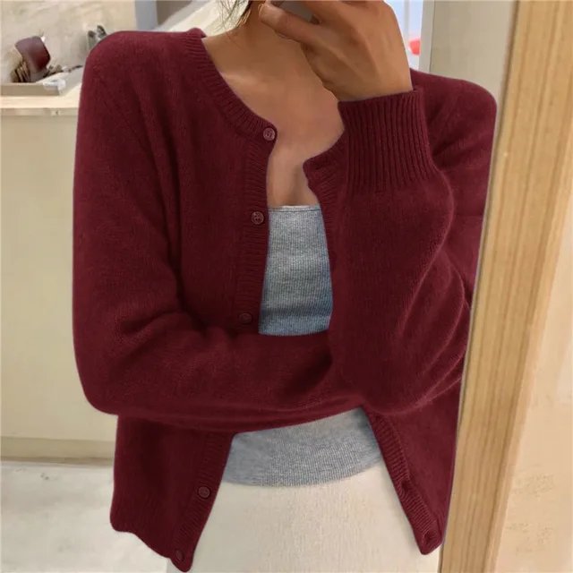 Women's cropped cardigan in black with button front, featuring a soft knit texture and relaxed fit, perfect for casual layering. 6