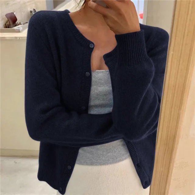 Women's cropped cardigan in black with button front, featuring a soft knit texture and relaxed fit, perfect for casual layering. 8