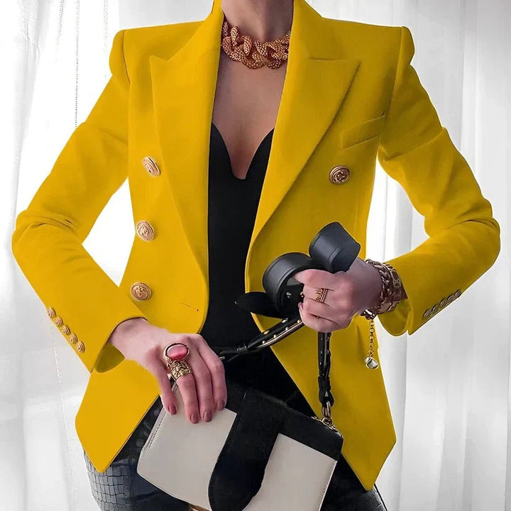 Women's double-breasted blazer featuring gold buttons and a structured fit, available in black and white options, perfect for professional or casual wear. 3