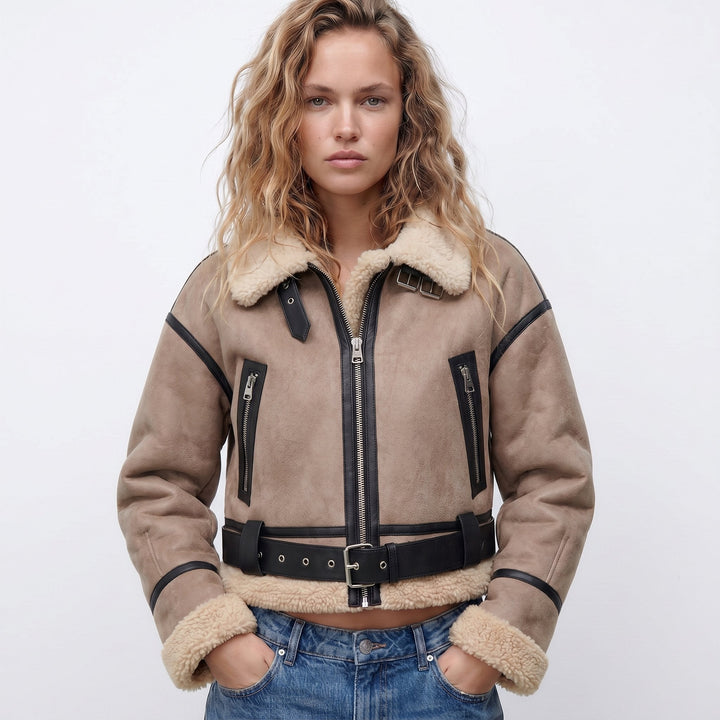 Women's double-sided shearling bomber jacket featuring a thick lining, perfect for versatile winter styling and protection against cold weather. 1